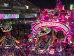 Colorful floats and flamboyant dancers are delighting tens of thousands jammed into Rio de Janeiro's iconic Sambadrome, putting on a delayed Carnival celebration after the pandemic halted the dazzling displays.(REUTERS)