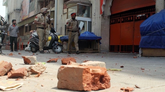 Police personnel patrol the street to maintain law and order after the clash that erupted between two groups near Kali Devi Temple, in Patiala on Friday. (ANI Photo)(Harmeet Sodhi)