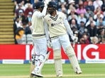 India's Mohammad Siraj, left, reacts with India's Jasprit Bumrah during the second day of the fifth Test(AP)