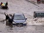 Vehicles wade through a heavily waterlogged stretch at NH24 near Mayur Vihar after heavy rain in New Delhi, India, on Wednesday, July 20, 2022. (Photo by Raj K Raj/Hindustan Times)