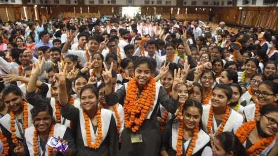 Students celebrate their success in the CBSE board result at RLB school in Lucknow.
