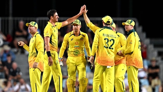 Australian paceman Mitchell Starc (2nd L) celebrates with Australian teammates(AFP)