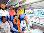 Railways minister Ashwini Vaishnaw and Haryana chief minister Manohar Lal Khattar ride the Delhi-Una Vande Bharat Express.(HT Photo)