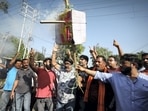 Members of the Rashtriya Bajrang Dal burn an effigy during a protest against the killing of Puran Krishan Bhat.(PTI)