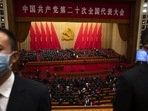 Security officers wearing face masks stand guard after the opening ceremony of the National Congress of China's ruling Communist Party.(AP)