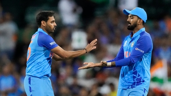 India's Bhuvneshwar Kumar, left, is congratulated by a teammate KL Rahul(AP)