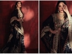 Madhuri Dixit, the 'dhak dhak' girl, once again set the internet ablaze with her jaw-dropping photos in a black embellished lehenga ser by one of India's most celebrated designers, Anamika Khanna.(Instagram/@madhuridixitnene)