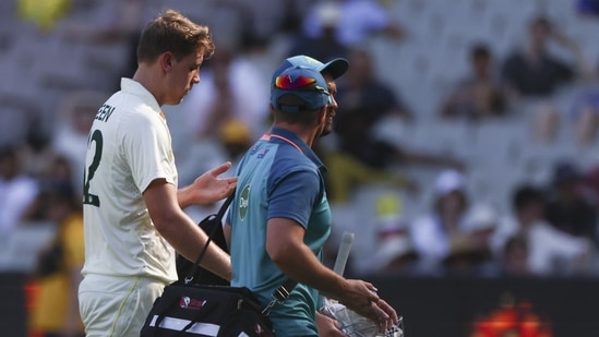 Australia's Cameron Green walks from the field after injuring his finger during the second cricket test between South Africa and Australia at the Melbourne Cricket Ground, Australia, Tuesday, Dec. 27, 2022. (AP Photo/Asanka Brendon Ratnayake)(AP)