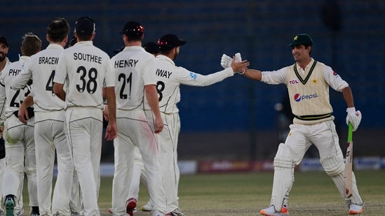 Pakistan's Naseem Shah (R) shakes hands with New Zealand's players at the end of the second cricket Test match between Pakistan and New Zealand at the National Stadium in Karachi on January 6, 2023. (AFP)