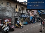 People seen in Lane number 11 in Kamathipura, Mumbai, on January 6. This month, deputy chief minister Devendra Fadnavis announced that Kamathipura, a grid of 15 lanes spread over 27.59 acres, will be gentrified under one of the largest cluster redevelopment schemes in the country. (Satish Bate / HT Photo)