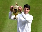 Carlos Alcaraz beat Novak Djokovic 6-2, 6-2, 7-6 (4) in the Wimbledon men's final on Sunday to retain his title.(AP)