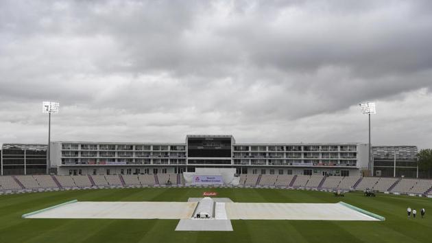 The covers are on as rain delays play on the first day of the 1st cricket Test match between England and West Indies, at the Ageas Bowl in Southampton, England, Wednesday July 8, 2020. (Mike Hewitt/Pool via AP) (AP)