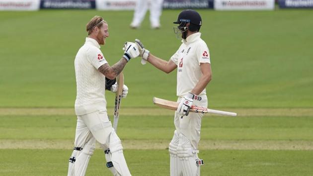 England's Ben Stokes, left, celebrate with teammate Dom Sibley after scoring a century during the second day of the second cricket Test match between England and West Indies at Old Trafford in Manchester, England, Friday, July 17, 2020 (AP)