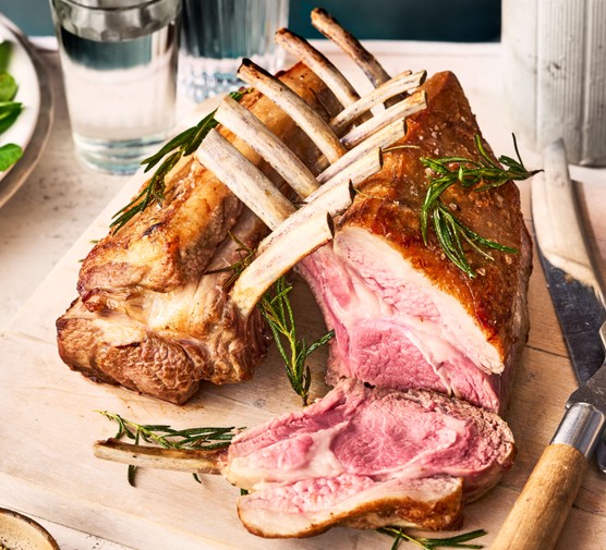 Rack of lamb on board with slice cut