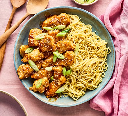Crispy lemon chicken with noodles in a bowl