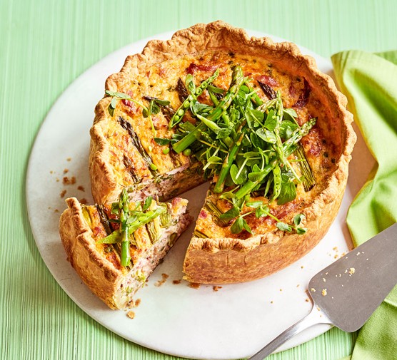 Asparagus, pea and ham hock tart topped with pea shoots