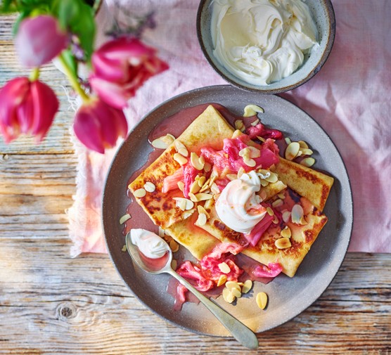 Spelt pancakes topped with rhubarb and creme fraiche