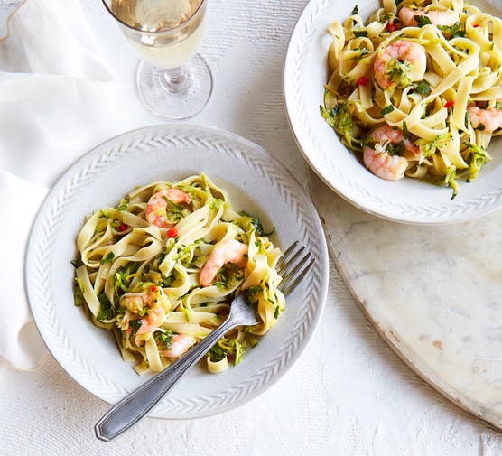 Lemony courgette and prawn tagliatelle in two white bowls