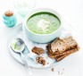 A bowl of cucumber, pea & lettuce soup with bread