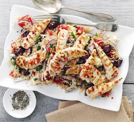 Griddled chicken with quinoa salad on a serving platter