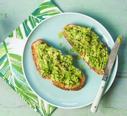 Two slices of toast topped with avocado spread