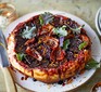 A plate serving beetroot & red onion tarte tatin