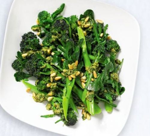 Long stem broccoli with mint on a plate