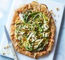 Charred courgette, lemon & goat’s cheese galette served on a chopping board