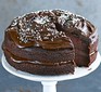 Vegan chocolate and avocado cake on cake stand