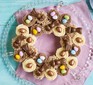 Cupcake wreath with chocolate eggs and bunnies on platter