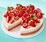layered cheesecake with strawberries on top