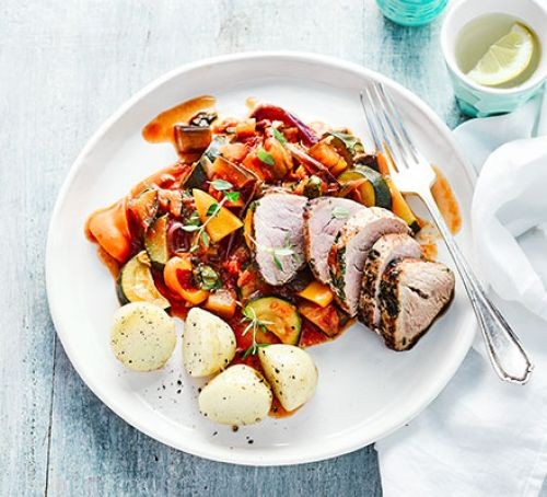 Herb & garlic pork with ratatouille and potatoes on a plate