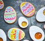 Egg-shaped biscuits decorated with icing and jammy centres