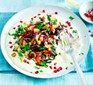 Colourful roast vegetables and pomegrantes with a drizzle of tahini yoghurt