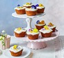 Little carrot cakes served on a cake stand