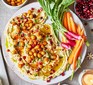 A plate serving luxury hummus alongside crudités