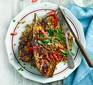 A plate with two miso-marinated aubergines on a bed of grains