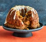 Carrot cake monkey bread served on a cake stand