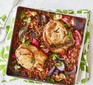 Pork chops with rhubarb and grains in a baking dish