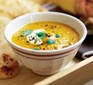 Carrot soup with cream in bowl