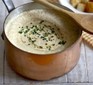 Mushroom soup with herbs in saucepan