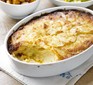 Dauphinoise potatoes in an oval dish with portion out