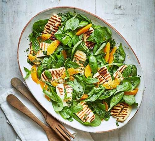 Spinach and halloumi salad in a plate
