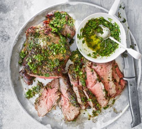 Barbecued lamb with green chutney on a platter
