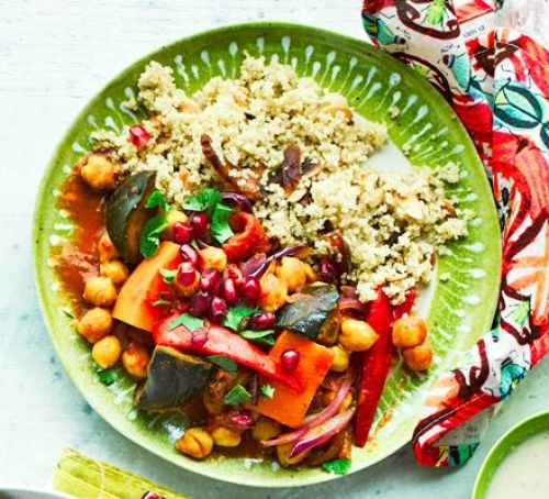 Vegetable tagine with couscous on a green plate