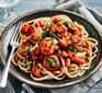 Meatballs on spaghetti topped with herbs