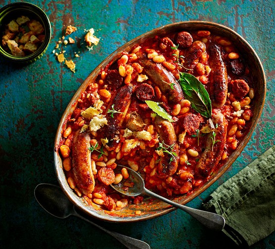 Double sausage & bean casserole with cheese-on-toast crumbs in a large baking dish