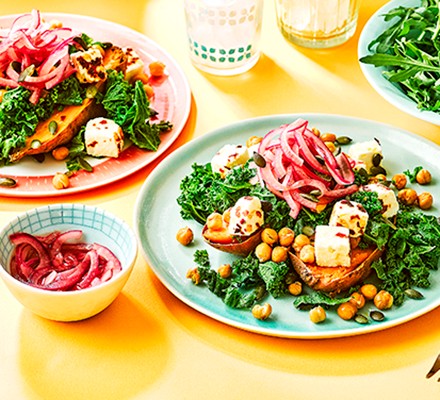 Feta & kale loaded sweet potato with pickled red onions
