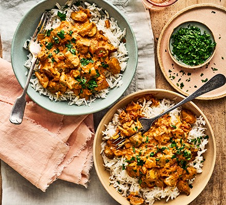 Two bowls of mushroom curry with rice