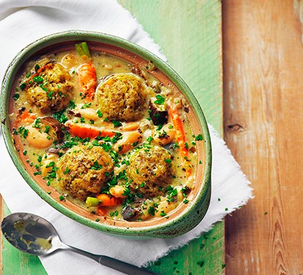 Vegetable stew with cheddar dumplings in a casserole dish